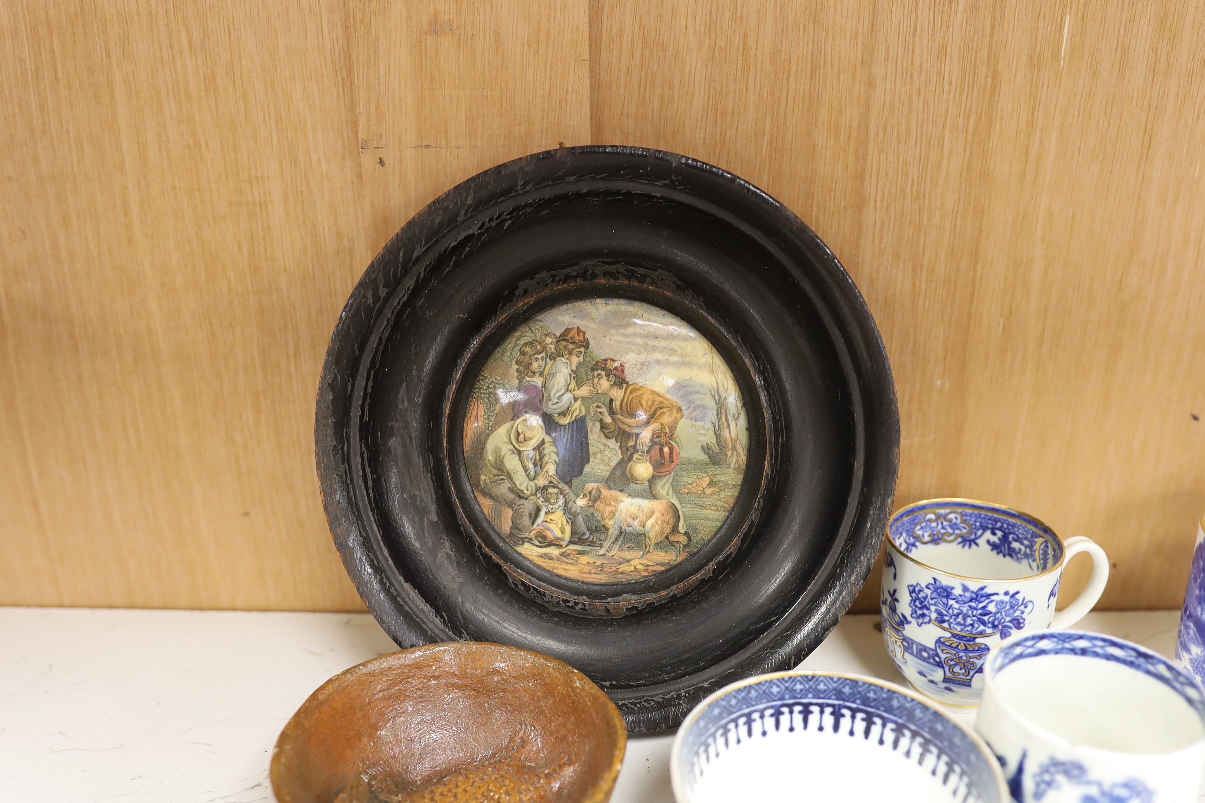 An early 20th century Viennese cold painted bronze figure of an African grey parrot, two 18th century English coffee cups, a leaf shape pickle dish, Victorian pot lid, other metal animal figures, a Japanese small carved